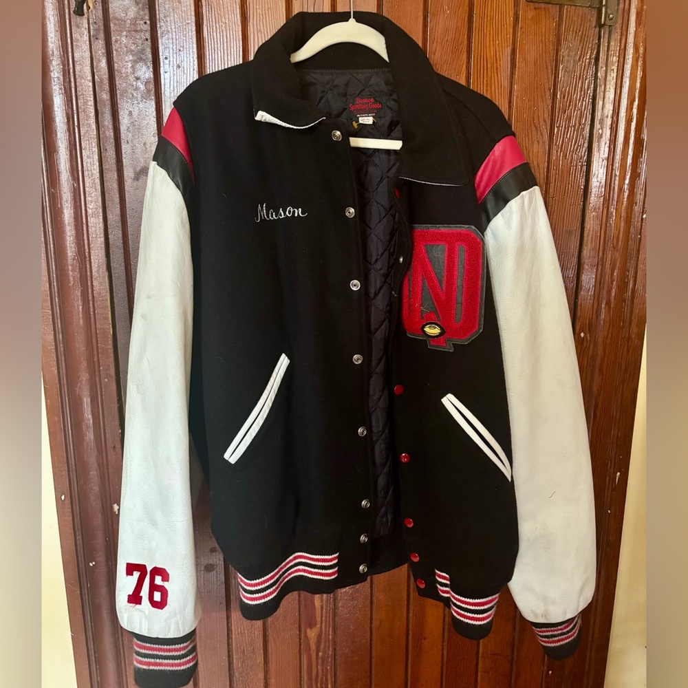 RED RAIDERS FOOTBALL.                   Black and White Varsity Jacket